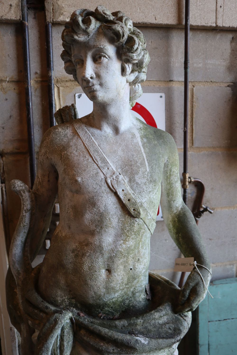 A reconstituted stone garden statue of an archer and hound, height 190cm